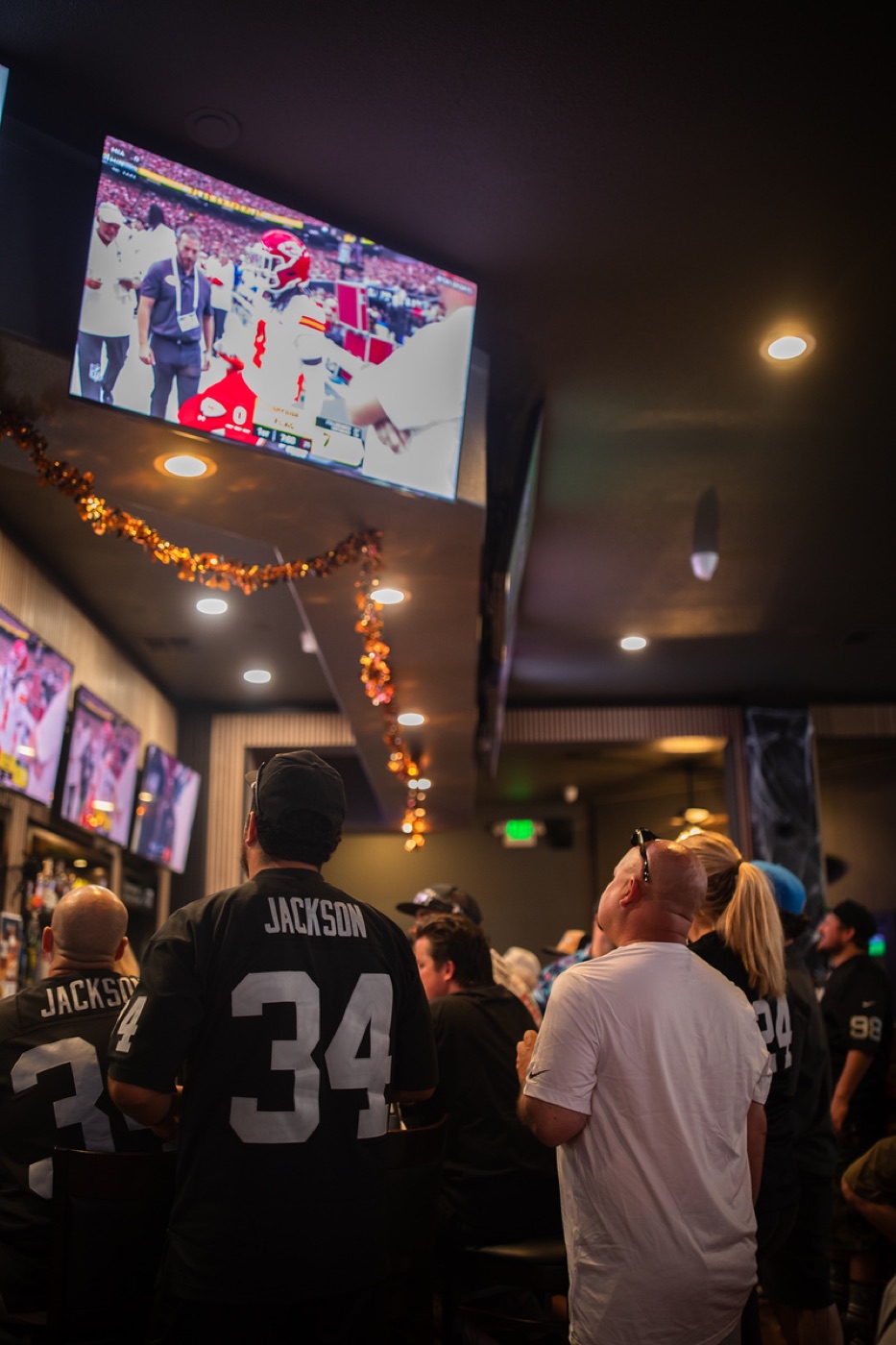 Fans watching the game at the bar at Meganos Well