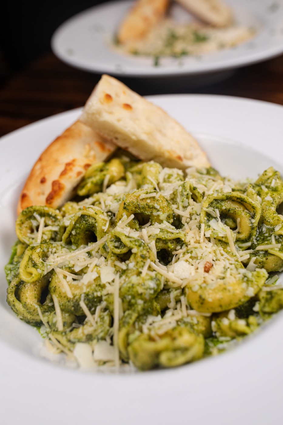 Pesto tortellini with Parmesan, close up